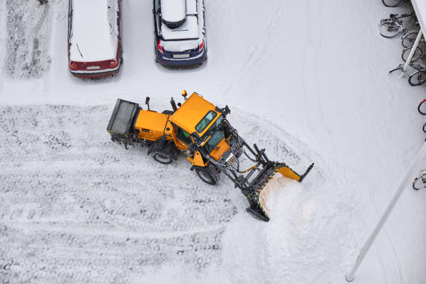 Tractor cleans a street after heavy snow