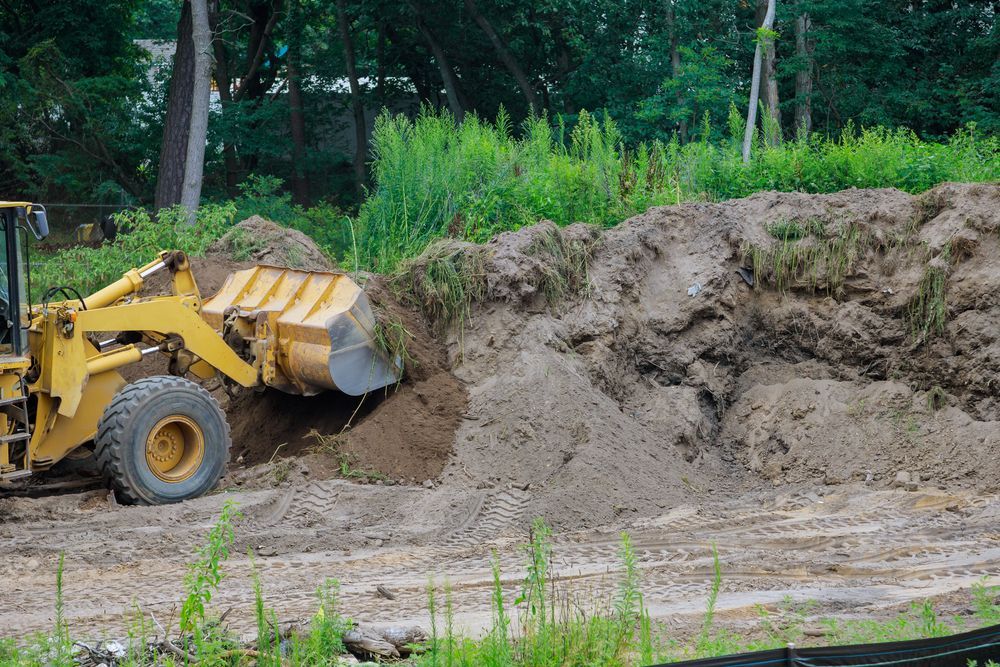 A bulldozer is moving dirt on a construction site.