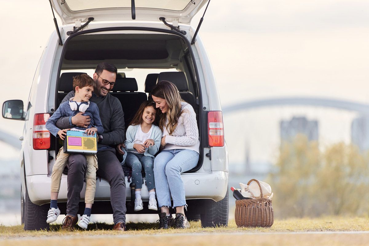 Happy Family in Car Trunk — Hollywood, FL — John Galt Insurance