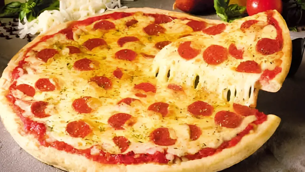 Pepperoni pizza with a slice being lifted, showing a cheesy pull.