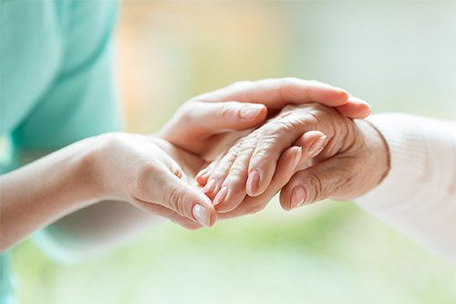 Nurse Holding The Hand Of Patient