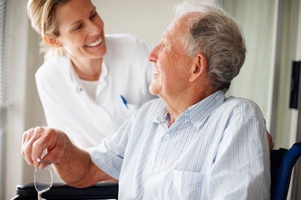 Elderly Man Speaking to a Nurse — Lake Worth, FL — A Visiting Redi-Nurse