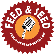 A logo for feed and seed with a microphone in the center
