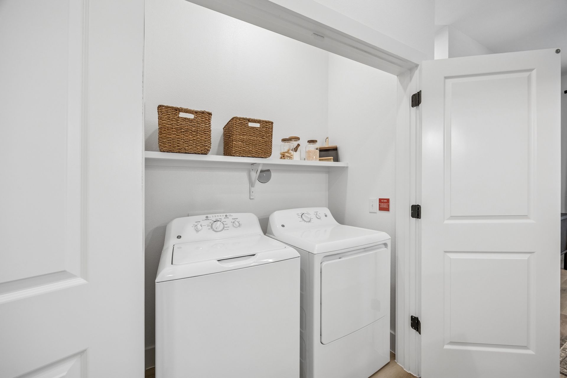 A laundry room with a washer and dryer in it.