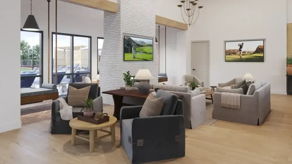 A living room with lots of furniture and a television on the wall