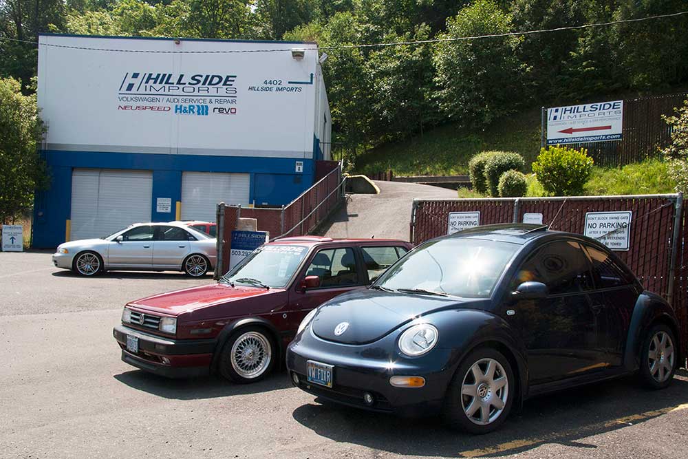 Black and Blue Car in Front of Garage — Portland, OR — Hillside Imports