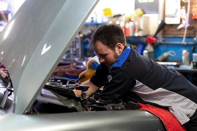 Man Fixing Car damage — Portland, OR — Hillside Imports