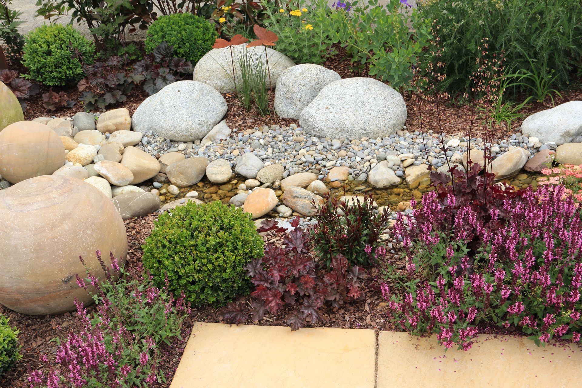 Rock garden, natural color perennial plants and and flowers