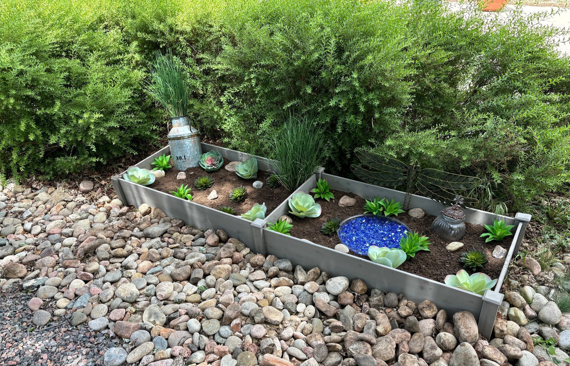 Knightscape project container garden with succulents and whimsical garden decorations