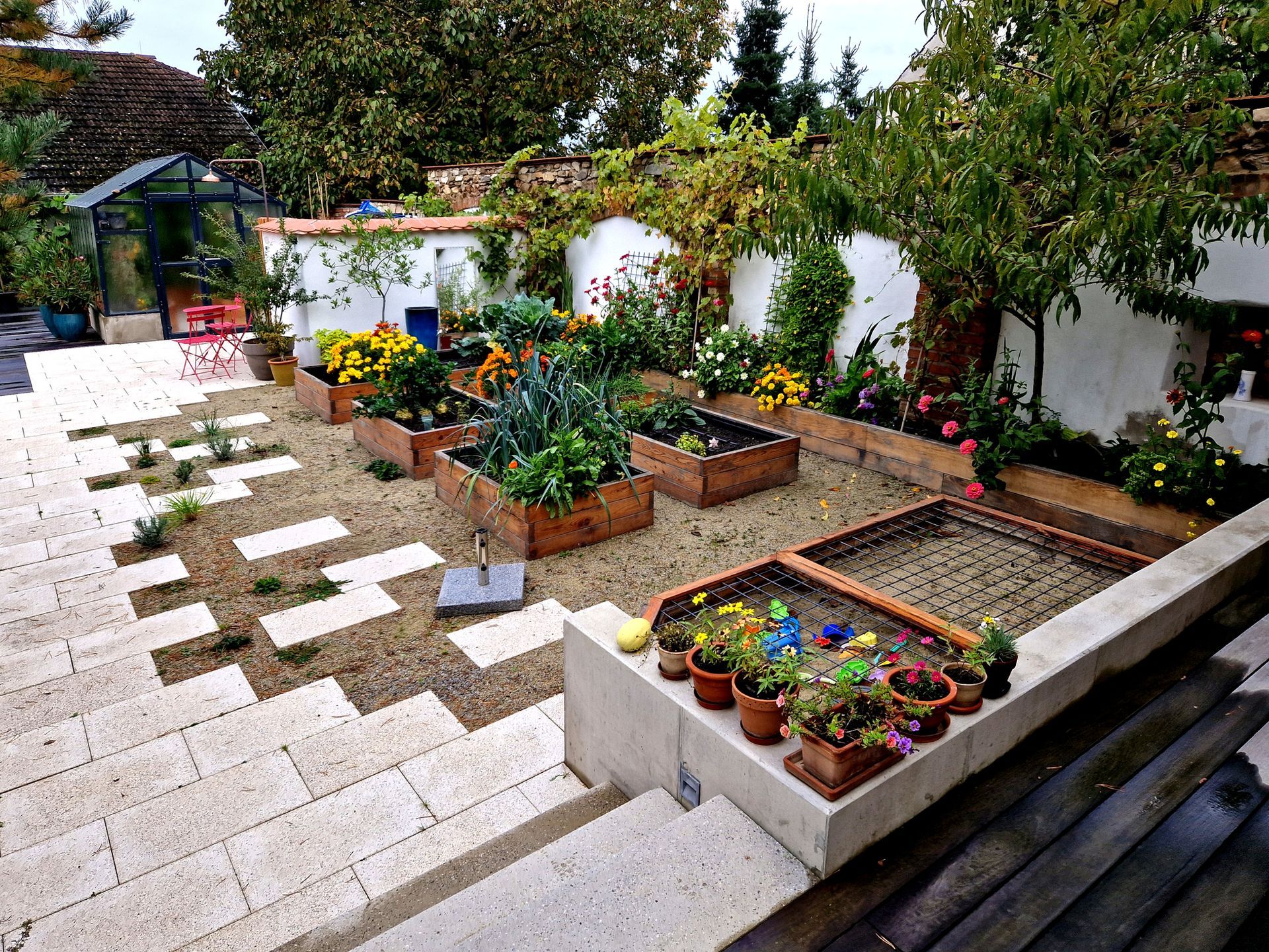 Patio with raised garden beds under construction