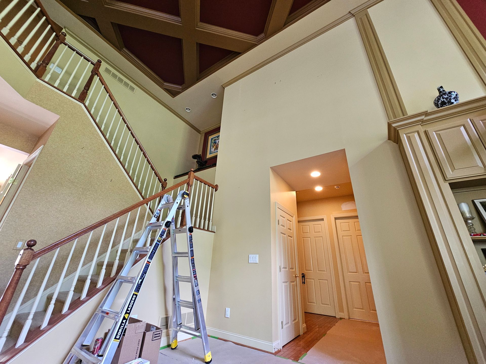 Interior of a home with a staircase, high ceiling. Westerville interior painting project. 