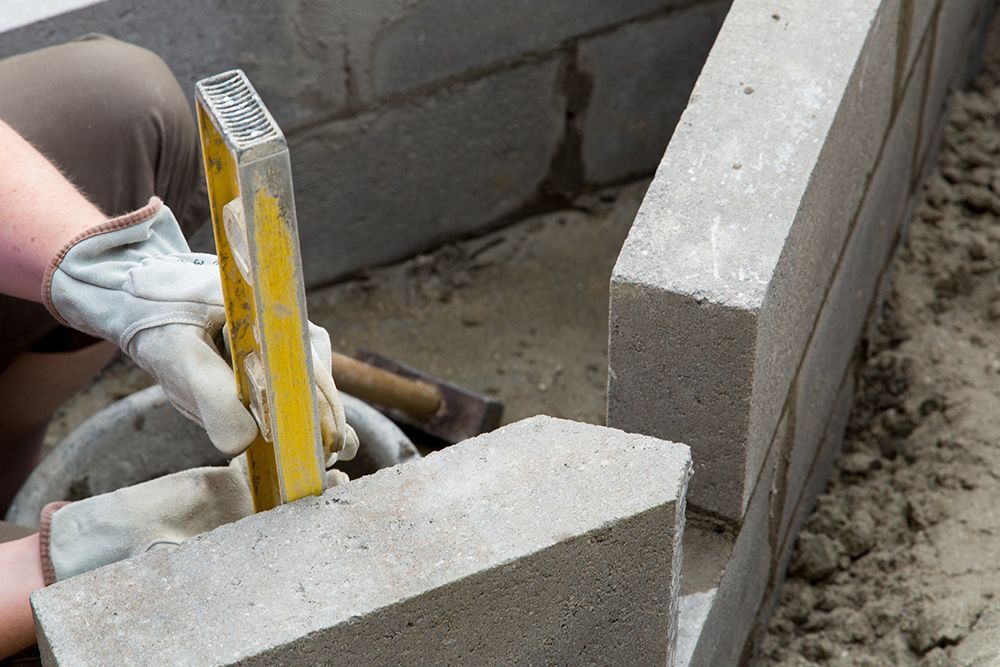 a person working on a construction project with cement