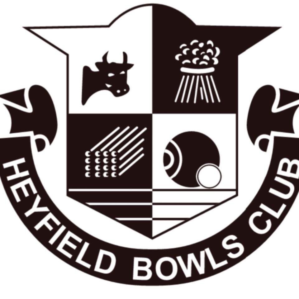 Heyfield Bowls Club logo: black and white crest with a cow, sheaf of wheat, bowling ball, and stylized wood pieces.