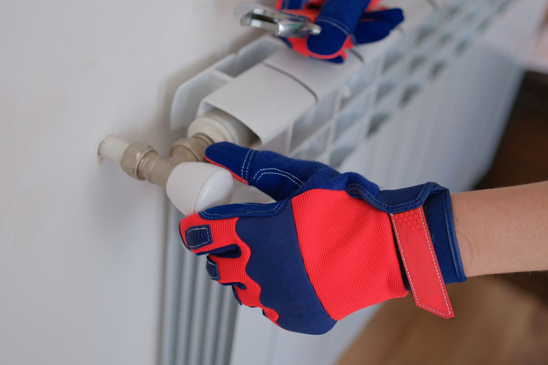 Closeup of heating radiator valve with repair key for precise temperature control.