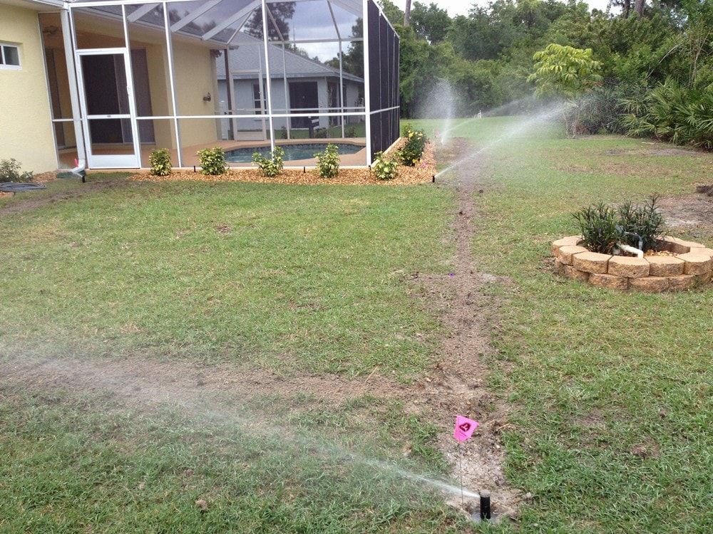 Residential Garden With Water Sprinklers — Port Charlotte, FL  — American Irrigation