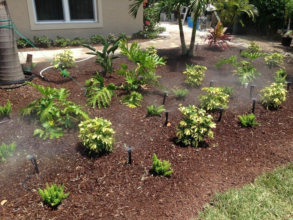 Garden With Working Water Sprinklers — Port Charlotte, FL  — American Irrigation