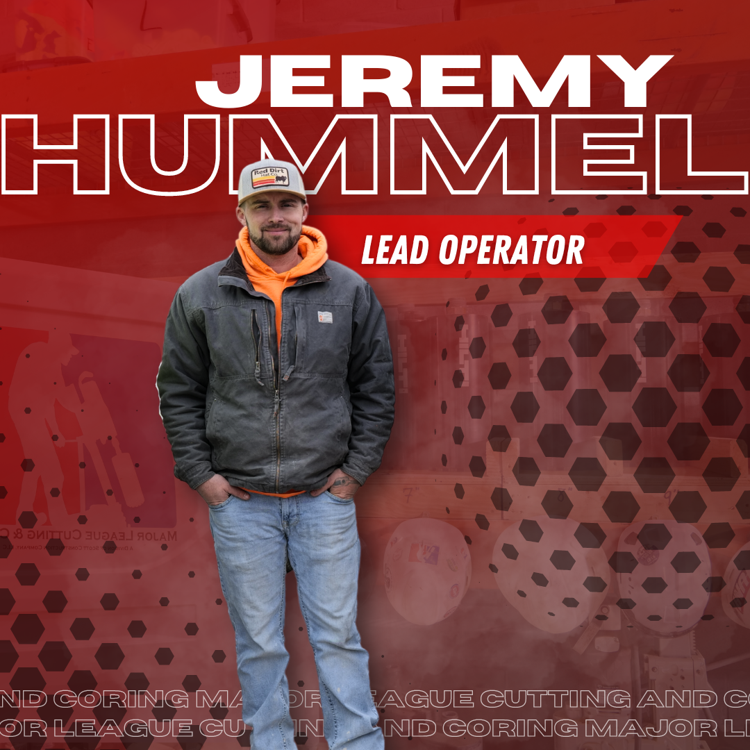 Jeremy hummel lead operator is standing in front of a red background