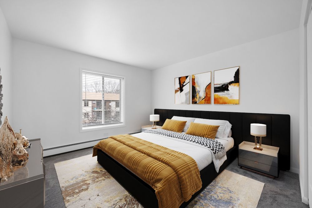 A bedroom with a large bed and a window.