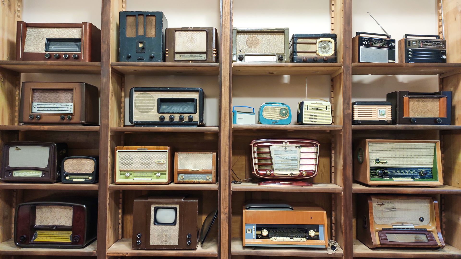 Rows of old transistor radios on a shelf. Rows of old transistor radios on a shelf.