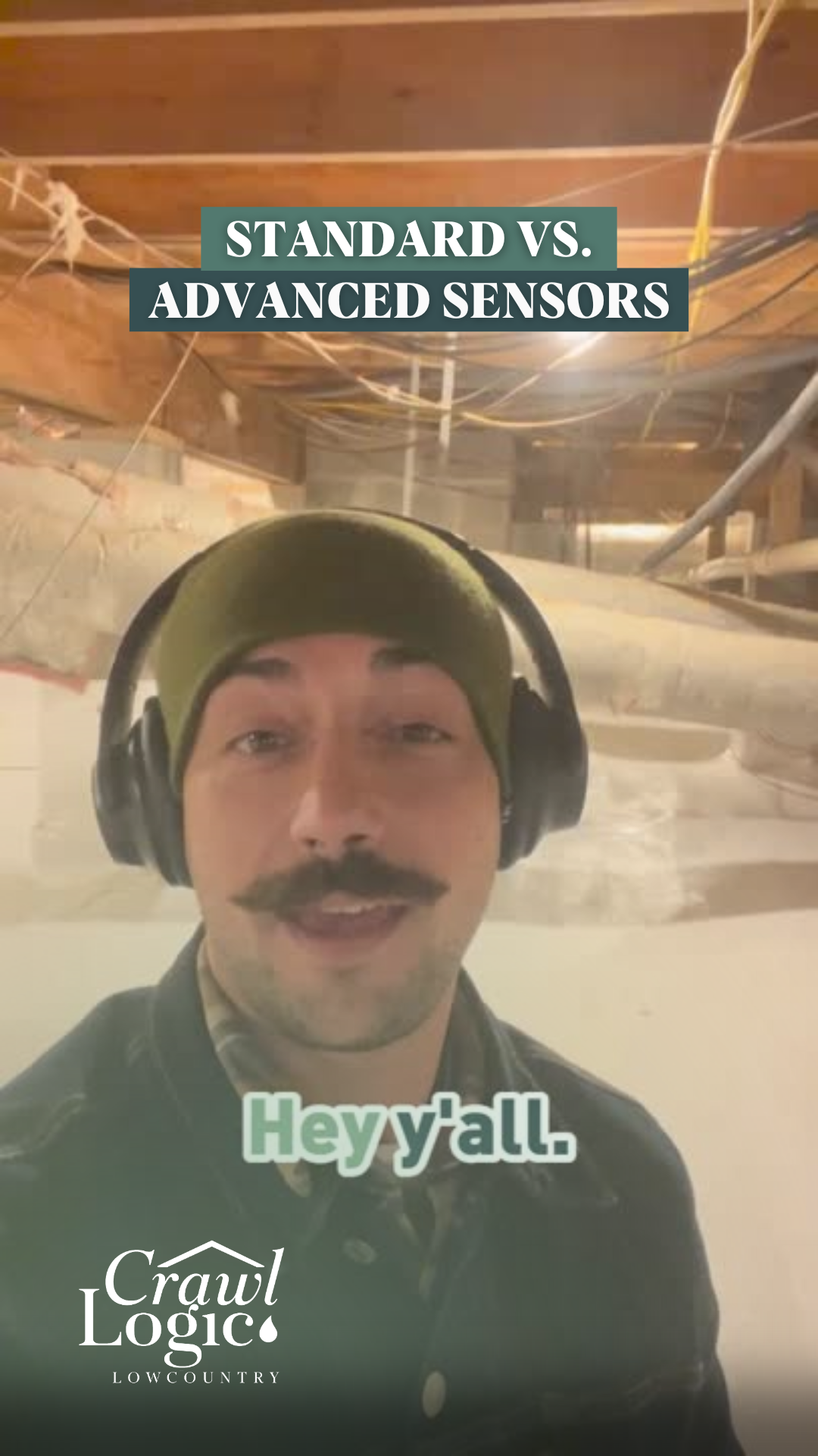 Man in beanie, headphones, and mustache in crawl space, discussing