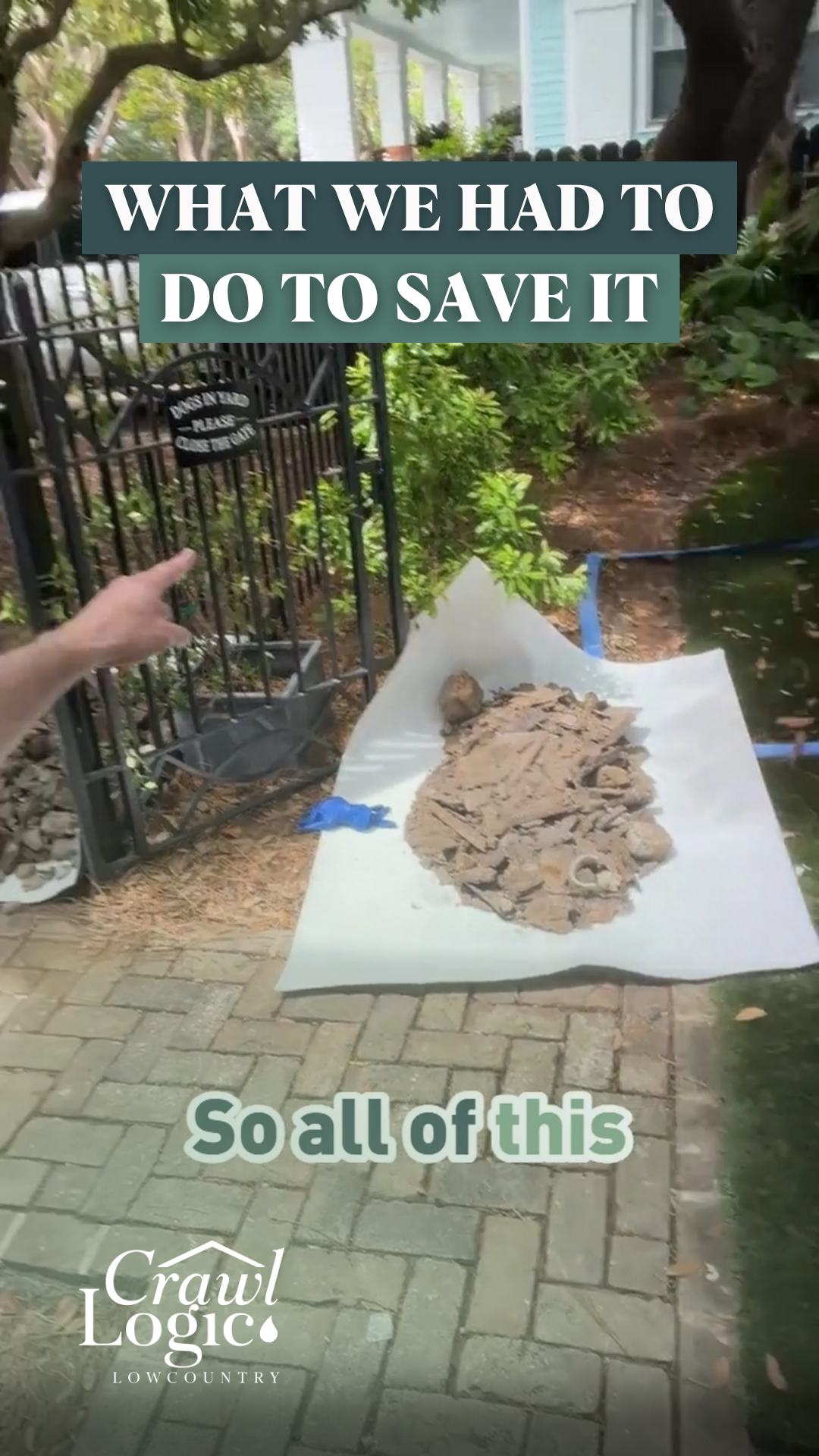 A person is pointing at a pile of sand on a brick sidewalk.