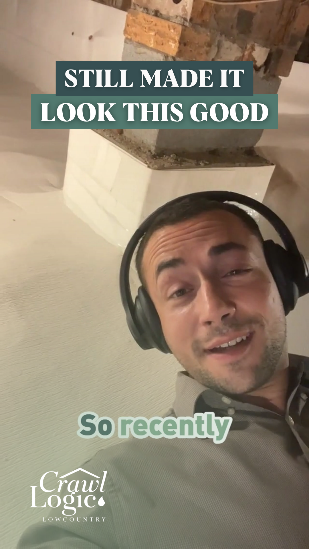 A man wearing headphones is standing in front of a pillar.