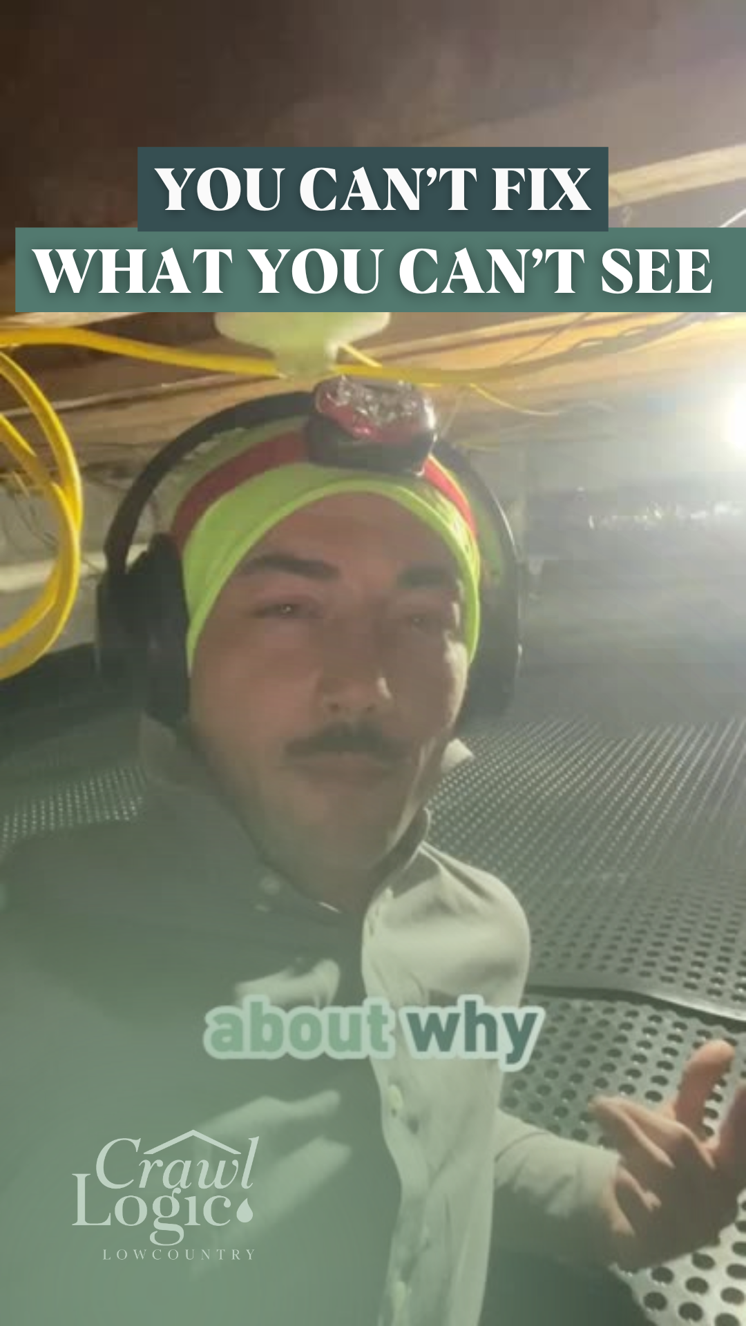 A man wearing headphones and a headlamp is standing in a dark room.