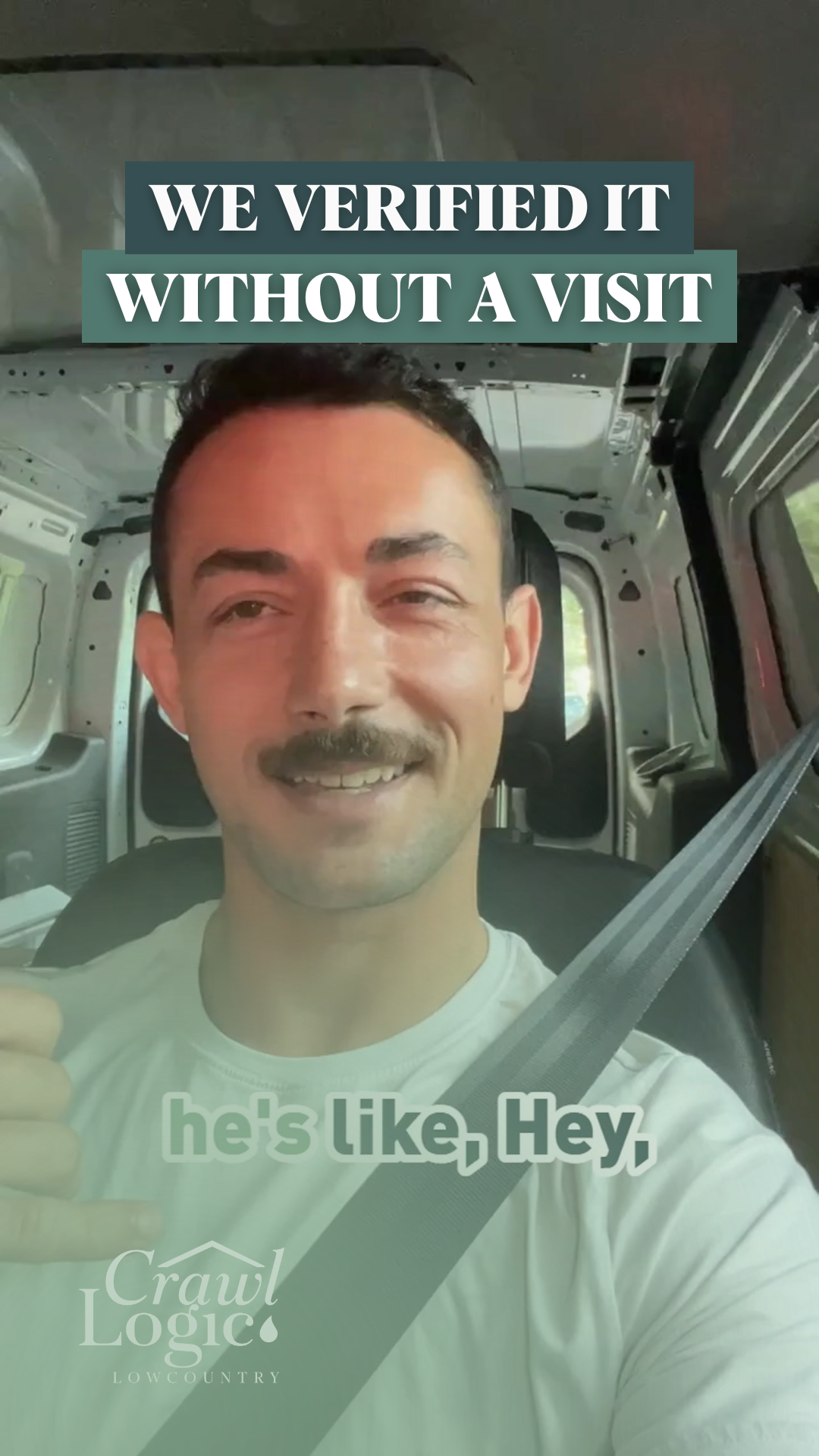 A man with a mustache is sitting in a van and smiling.