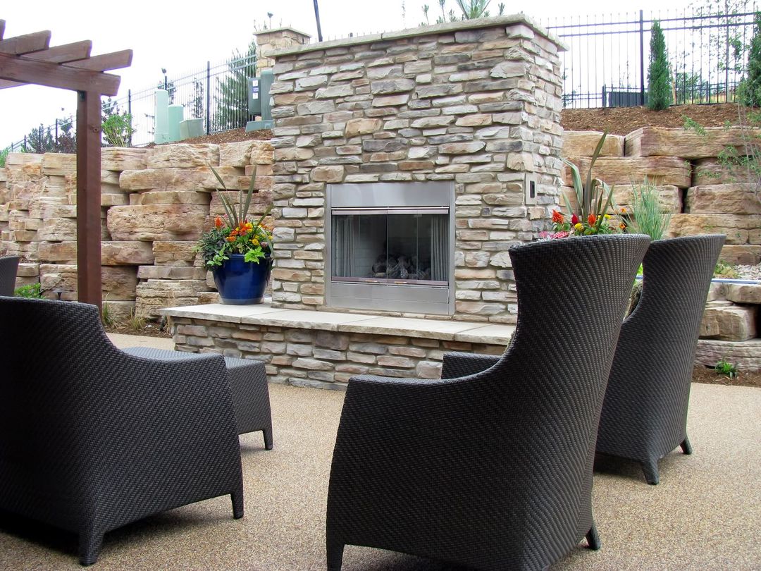 outdoor stone fireplace on patio