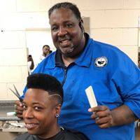 A man is cutting another man 's hair in a salon.