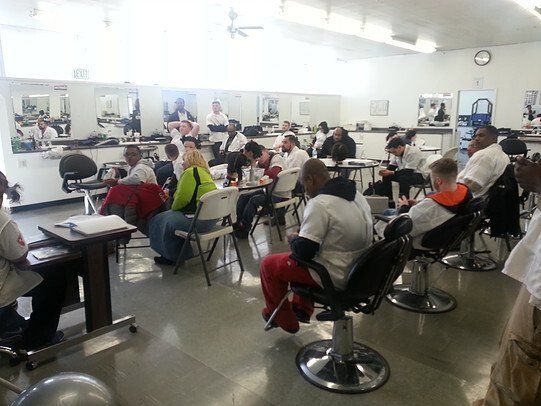 A group of people are sitting in chairs in a room