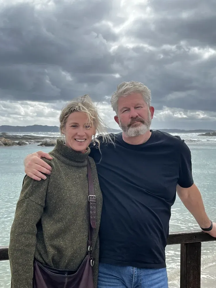 Dr Bruce and Annabel are posing for a picture.