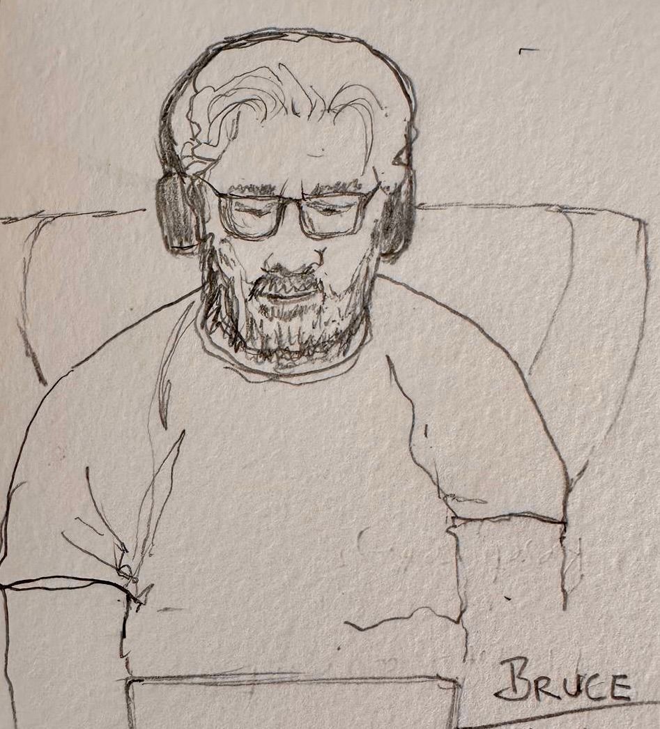 Pencil sketch of a man with glasses and headphones, seated against a plain wall, labeled “Bruce.”