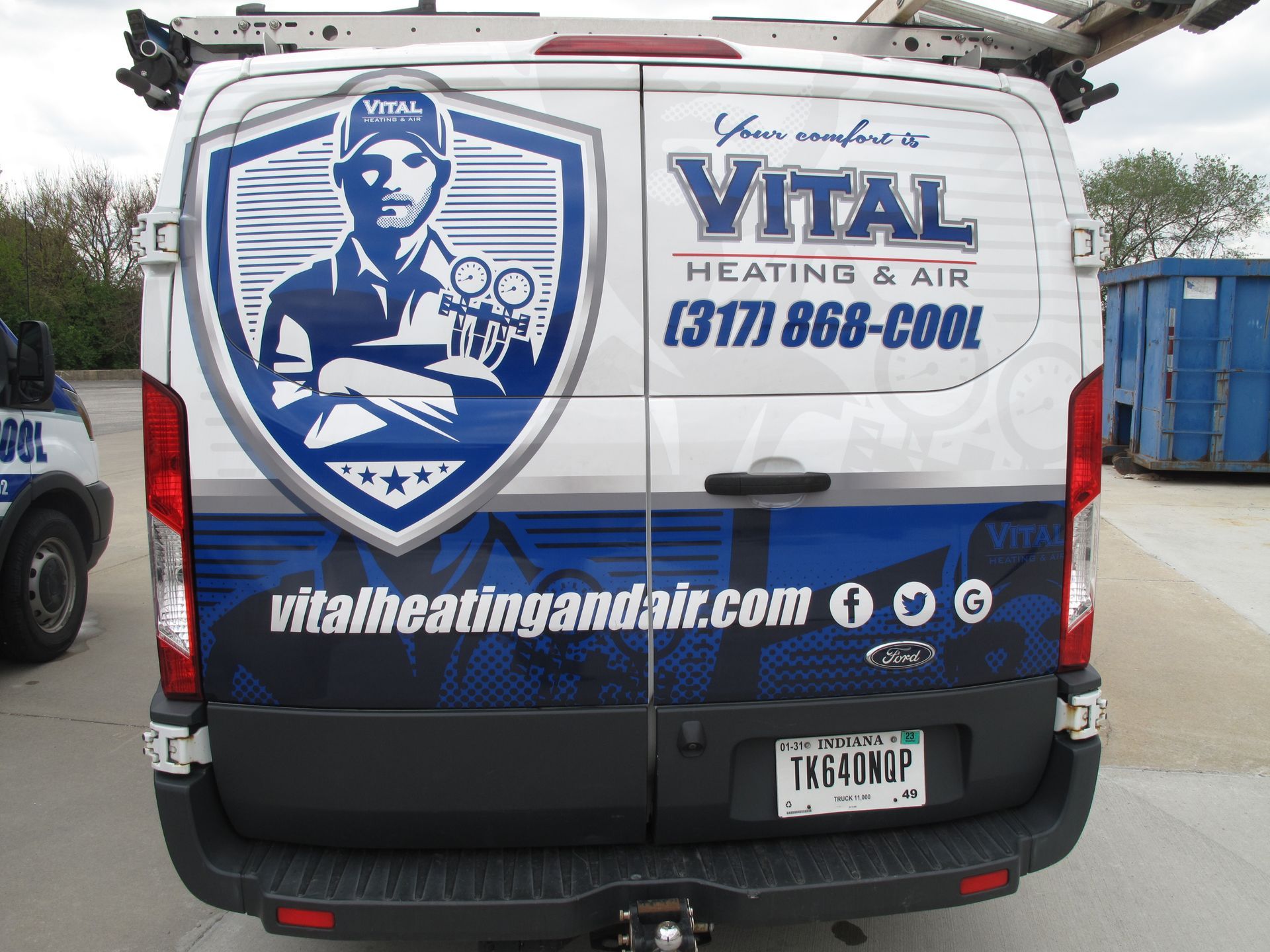 AVital Heating & Airr van is parked in a parking lot