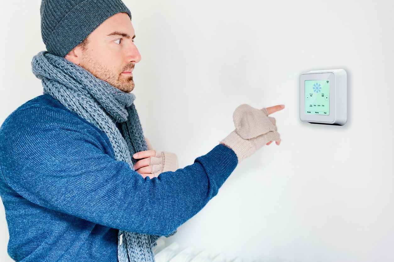 A cozy Indianapolis home with a smart thermostat displaying energy-efficient settings during winter.