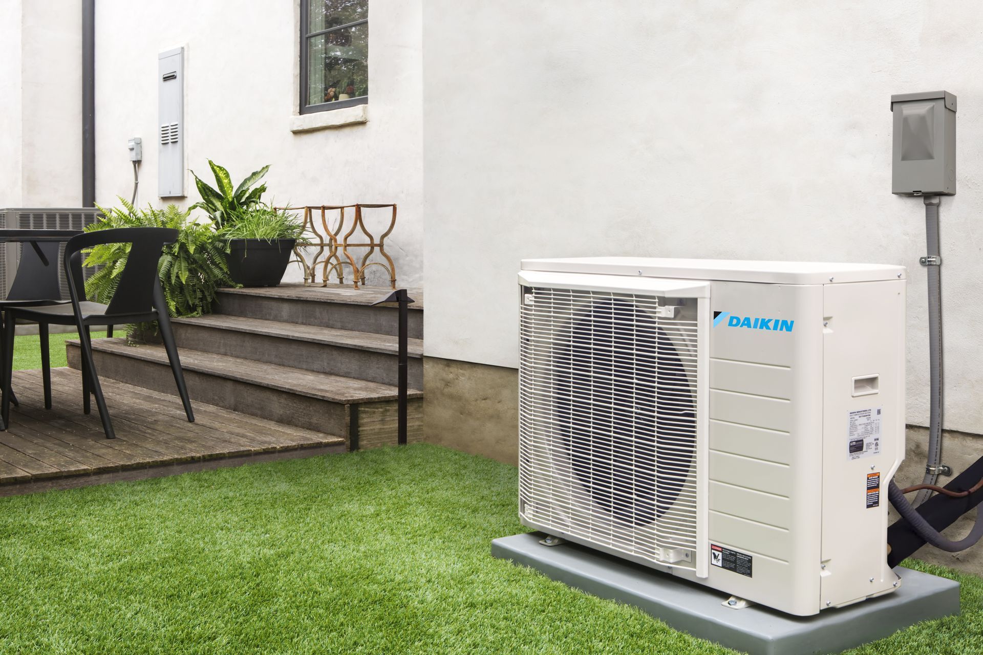 Technician performing a tune-up on a Daikin Fit heat pump in Indianapolis.