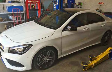 White Car In Auto Service — Automotive Mechanical Repairs in Caloundra West, QLD