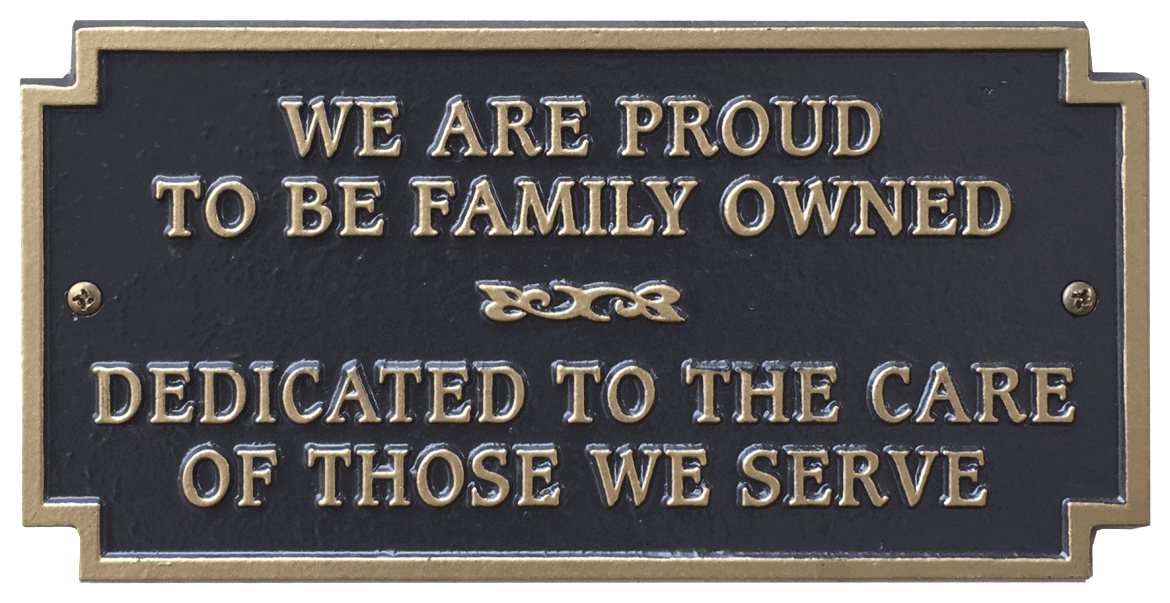 A sign that says we are proud to be family owned dedicated to the care of those we serve