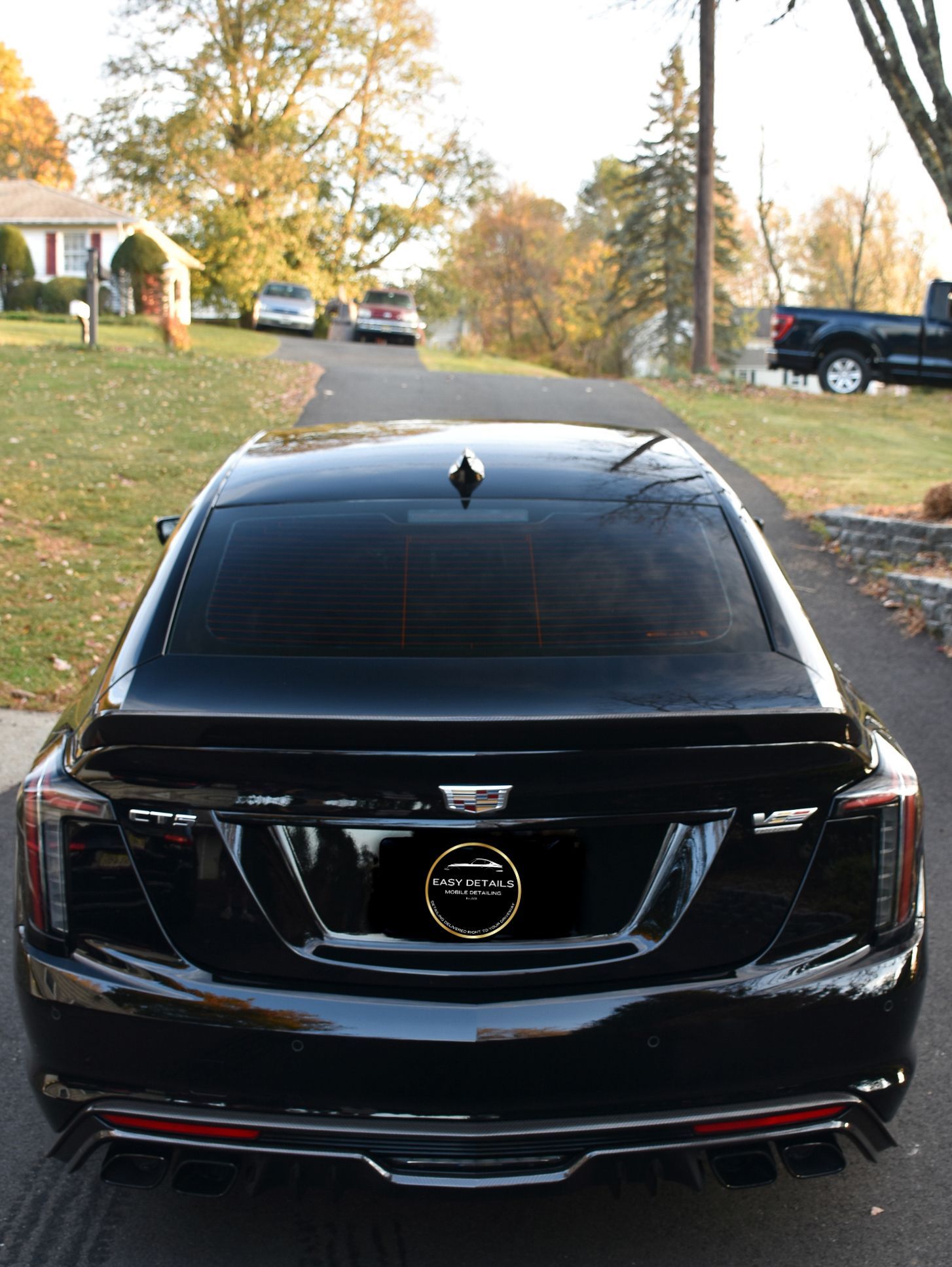 a gray sports car is parked in a showroom .