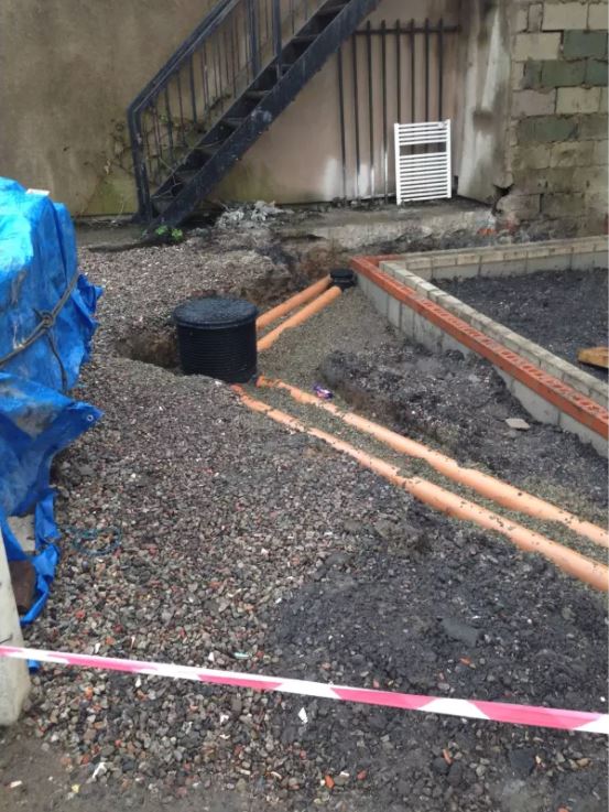 land area full of mud and stones before paving