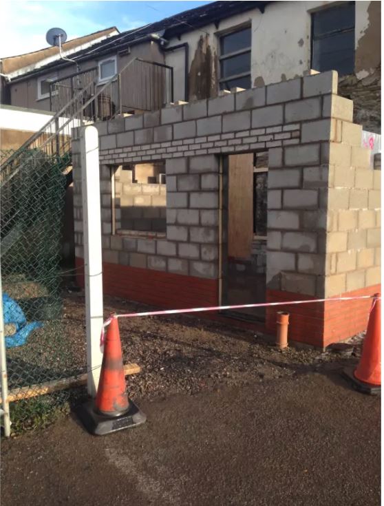wall erection for extending a house