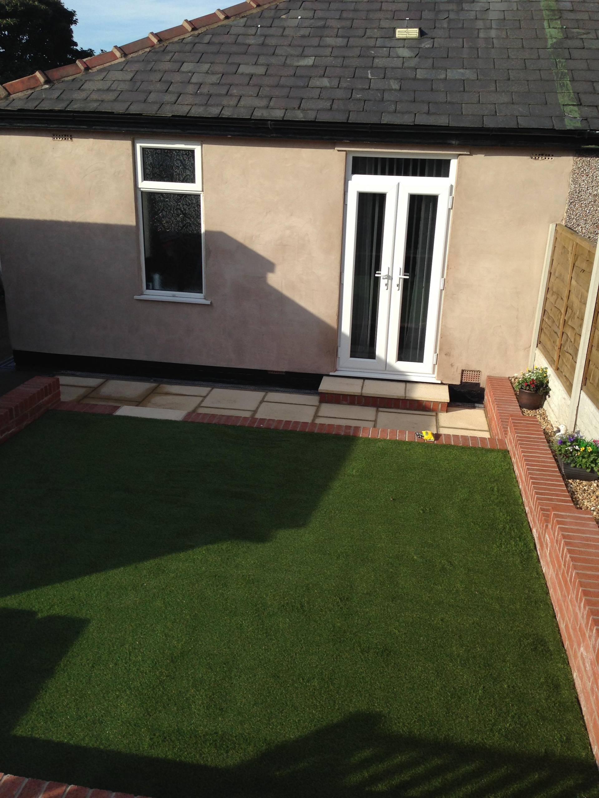 a glass door leading to garden area