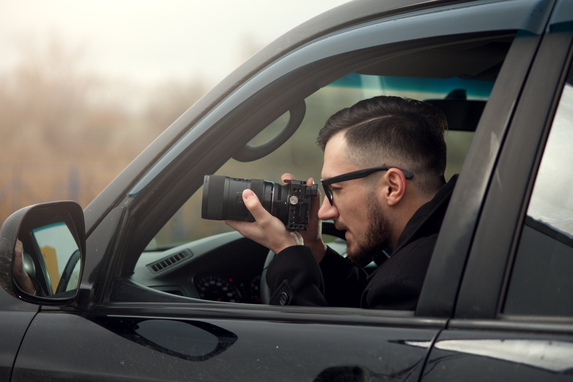 private investigator taking picture surveillance