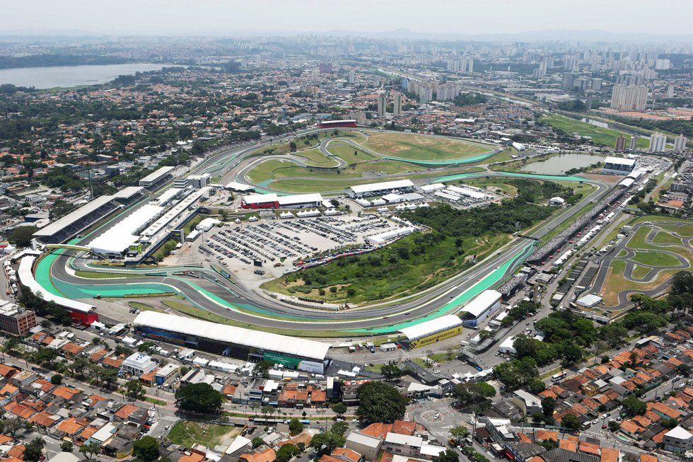 An aerial view of a race track in the middle of a city.