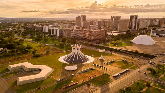 An aerial view of a city with a large dome in the middle of it.
