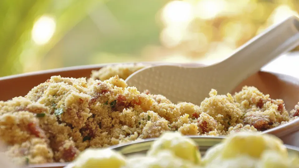 A bowl of food with a spoon in it.