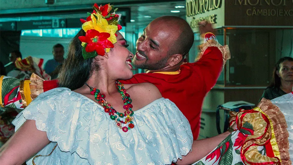 A couple dancing Carimbó in traditional clothing in Belém.