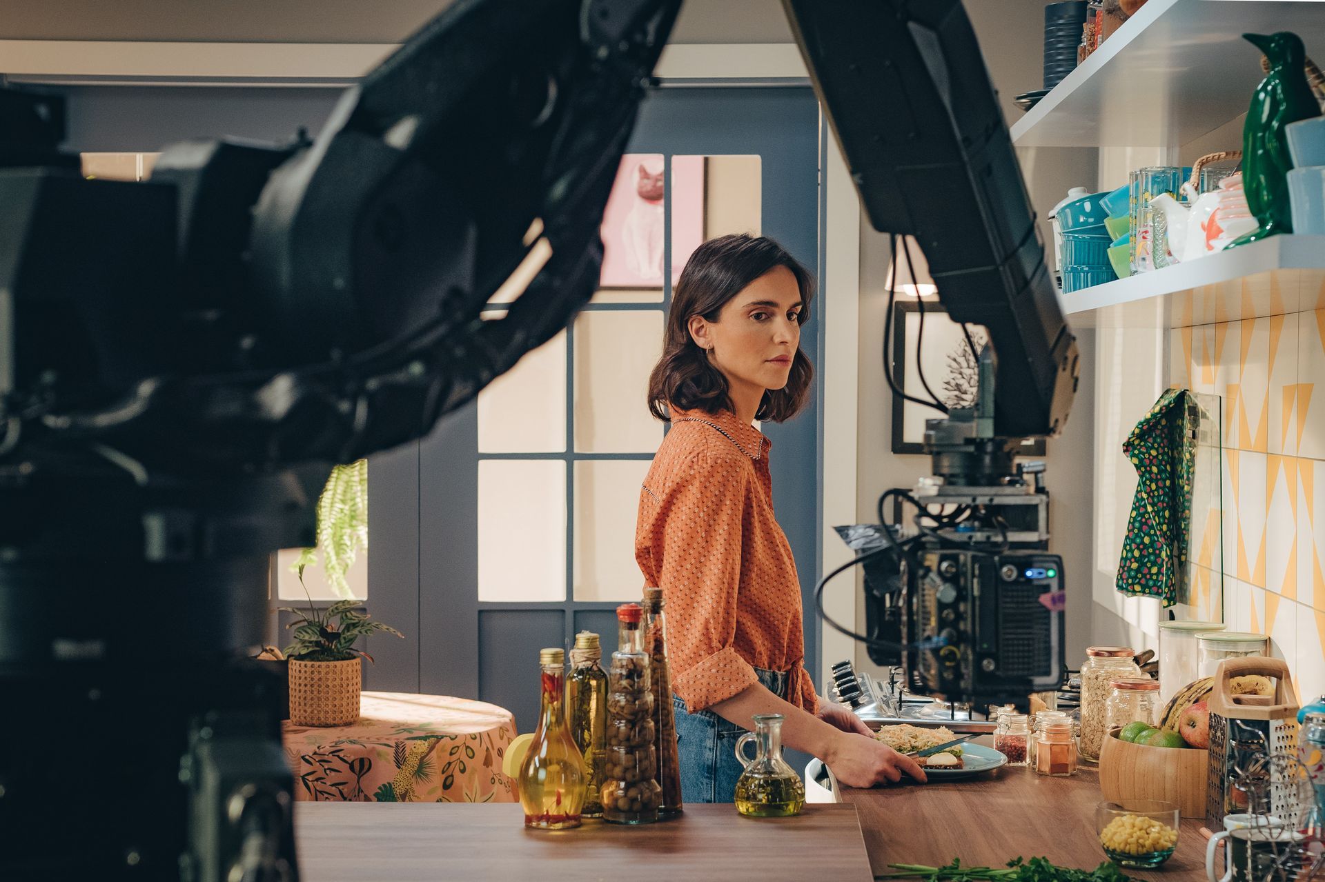 Model during TVC Hellmans shoot with robot arm.