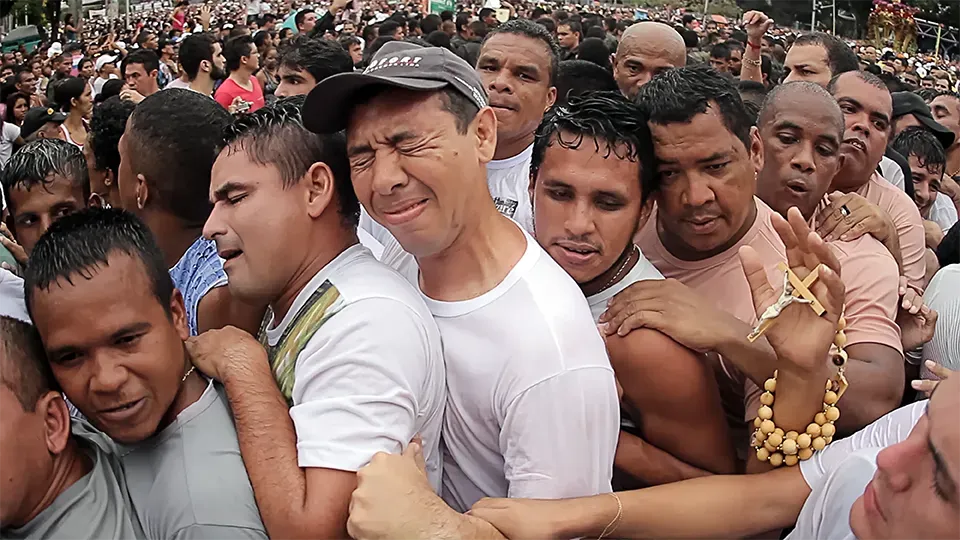 A crowd of people are standing in a line.