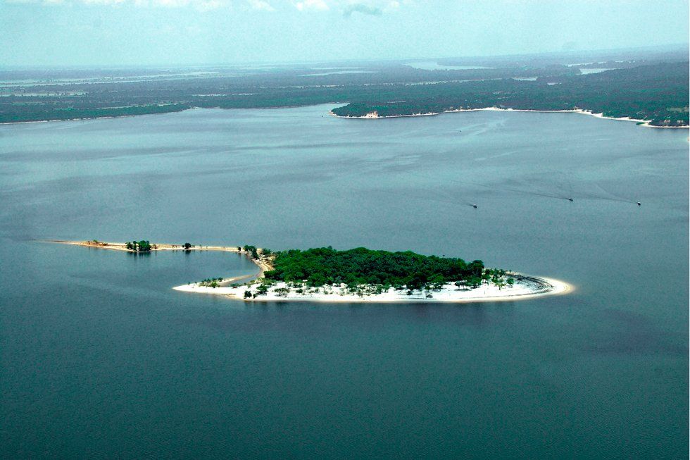 An aerial view of a small island in the middle of a large body of water